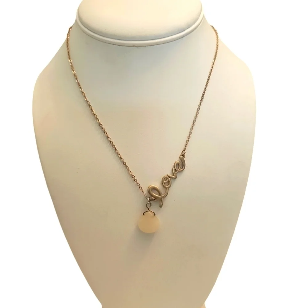 Elegant Gold Necklace with Milk Glass Teardrop Pendant and Circular Accents